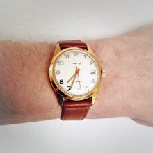 Prim wristwatch with gilded case